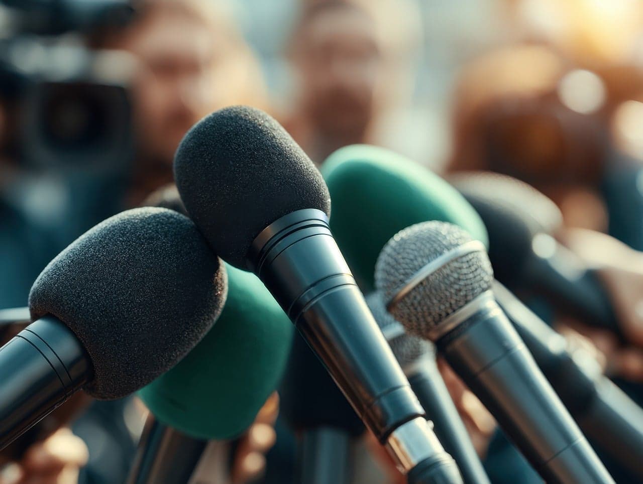 A microphone at a press conference podium